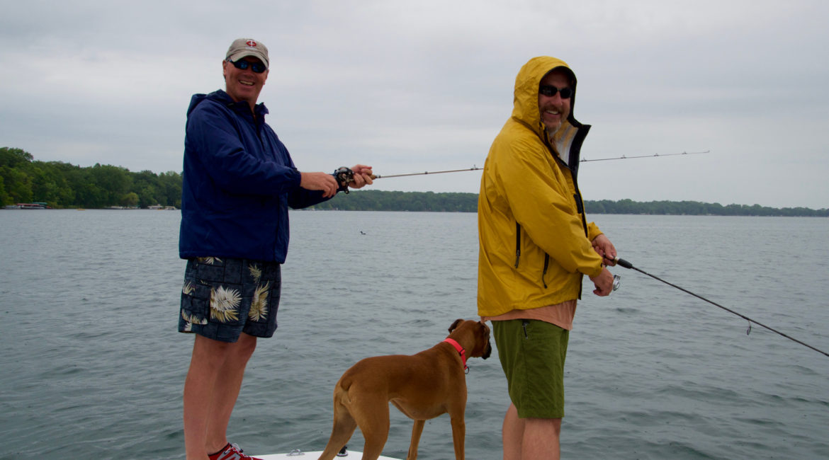 Deer Lake Improvement Association two gentleman and a dog on the dock