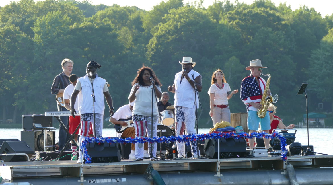 Deer Lake Improvement Association Pontoon with band on the lake